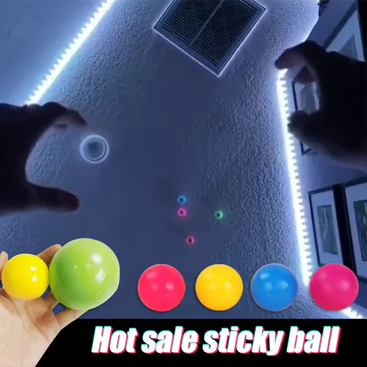 Assorted colorful sticky balls for stress relief and indoor play, shown on textured wall