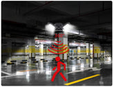 Adjustable LED garage light with 360-degree motion sensor in parking lot setting
