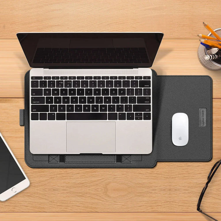 Stylish black leather laptop sleeve with integrated mouse pad on a wooden desk