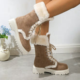 Women’s tan suede winter boots with white faux fur lining and chunky sole.