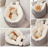Soft, plush grey and white pet bed with cozy faux fur lining, cradling a sleeping cat.