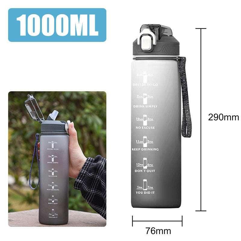 Large gray 1000ml water bottle with time markers, flip-top lid, and wrist strap