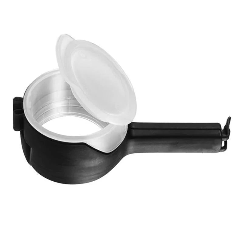 Black and silver dumpling maker with a hinged lid and durable plastic handle