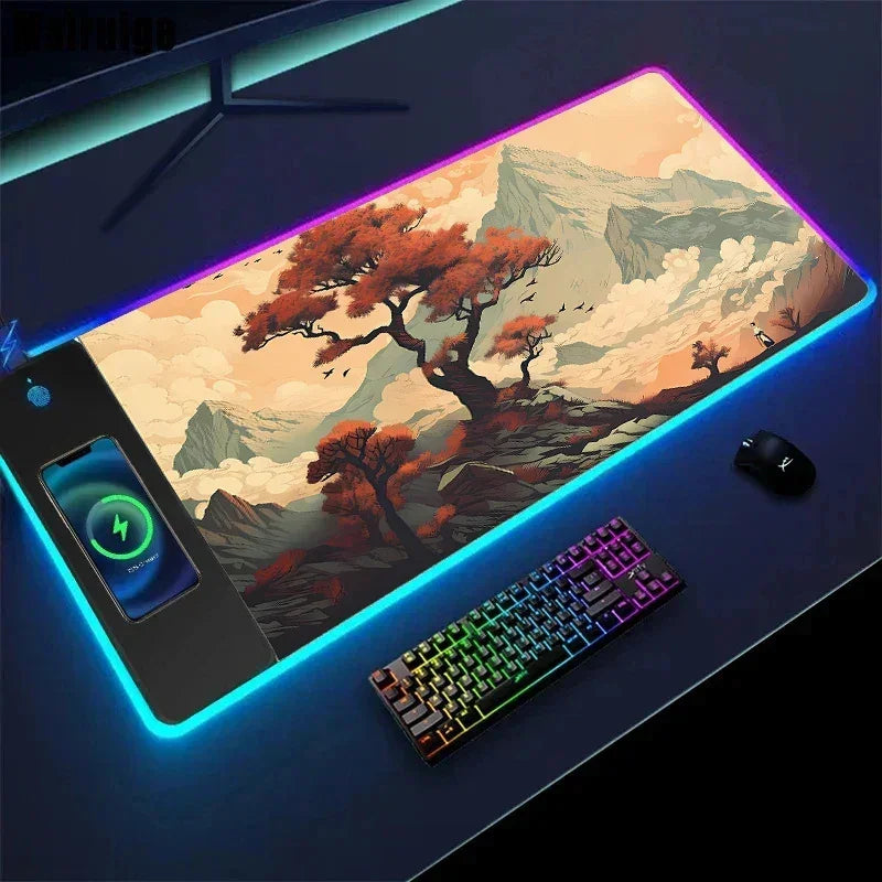 Large RGB gaming desk mat with landscape design, wireless charging pad, and soft textured surface