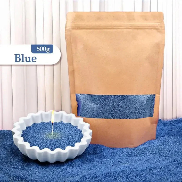 Blue sand granules in brown resealable bag and white bowl, used for decorative candles