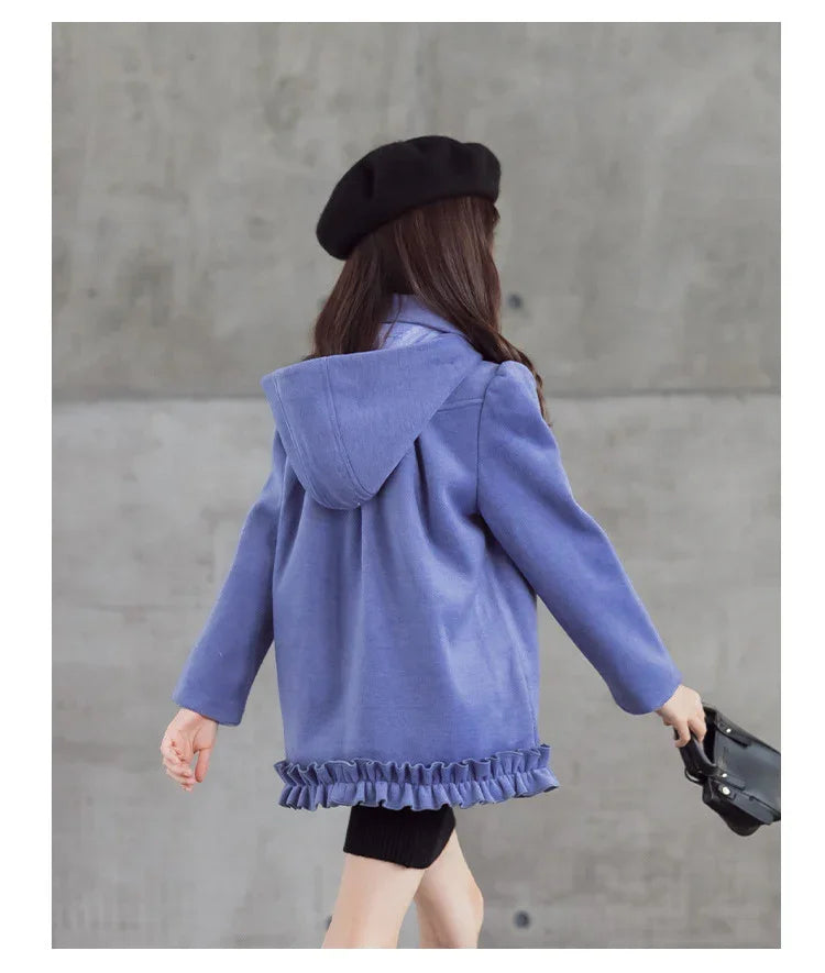 Girl wearing purple hooded coat with ruffle hem, relaxed fit, and black beret