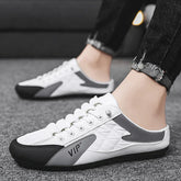 White and gray slip-on sneakers with quilted detail, black sole, low-cut fit