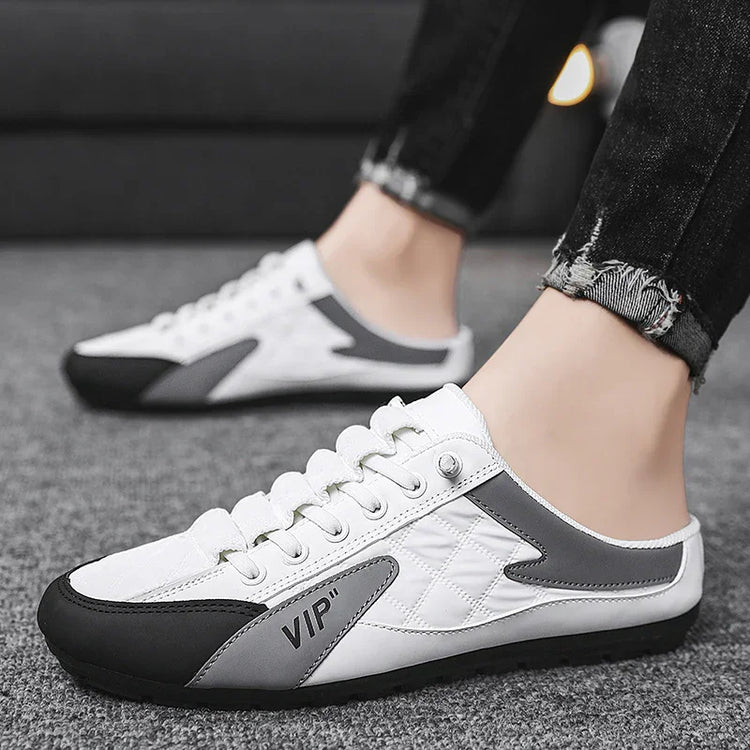 White and gray slip-on sneakers with quilted detail, black sole, low-cut fit