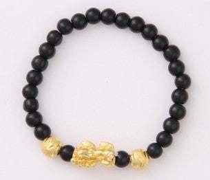 Black beaded bracelet with gold-toned decorative charms, minimalist streetwear accessory