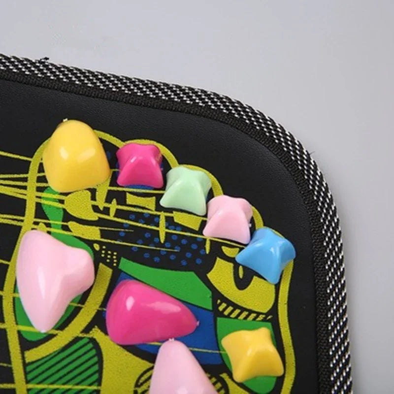 Close-up of a black fabric mat with colorful raised massage stones, textured edge detail