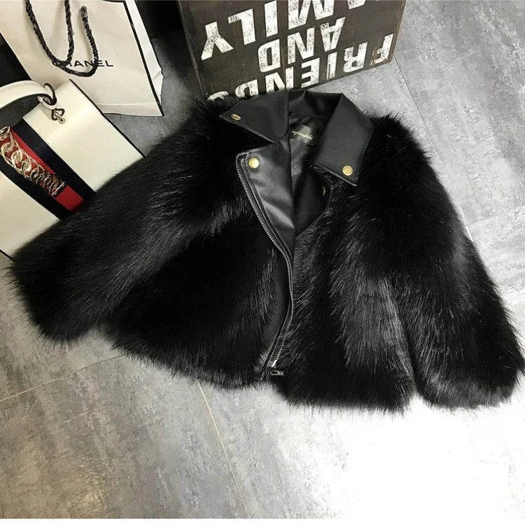 Black faux fur jacket with leather collar and gold snap details, modern cropped fit