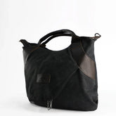 Black canvas and leather tote bag with zipper, modern streetwear accessory