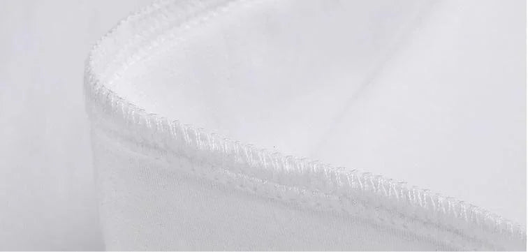 Close-up of white cotton fabric with reinforced stitching, showcasing smooth texture and quality finish.
