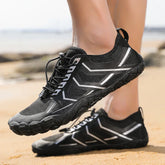 Black athletic water shoes with white geometric accents, lightweight mesh material, slim fit