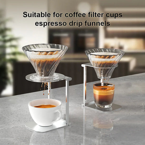 Glass pour-over coffee drippers with metal stands brewing into white ceramic and glass cups