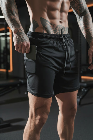Black athletic shorts with side pocket, drawstring waist, and fitted design for active wear