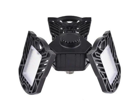 Adjustable black LED garage light with three foldable panels, modern industrial design
