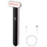 Handheld LED light therapy device with black and rose gold finish and included USB charging cable