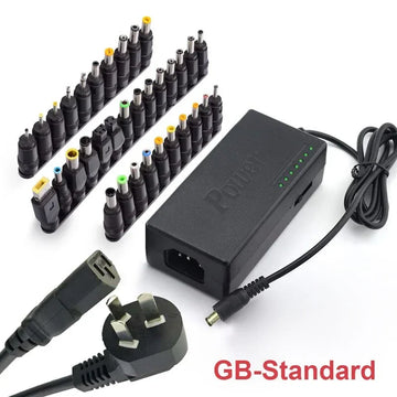 Universal laptop charger with UK plug, multiple interchangeable black power tips.