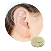Gold magnetic ear stud on ear, metallic finish, minimalistic non-piercing accessory.