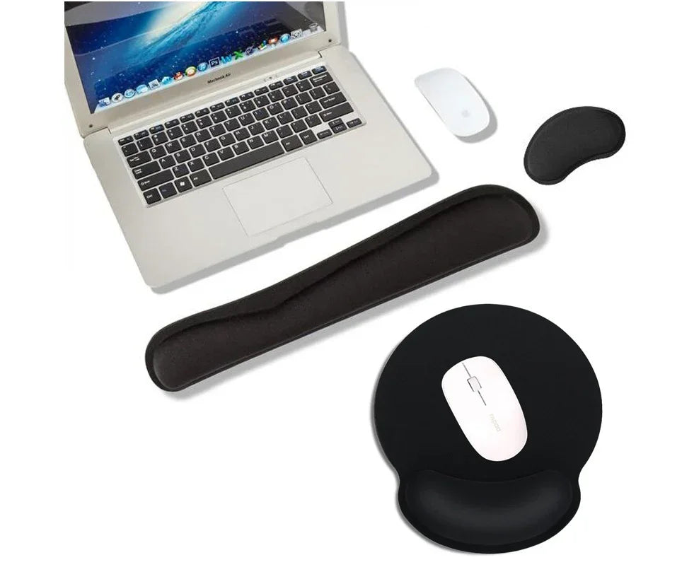 Ergonomic black wrist rest set and mouse pad with laptop and wireless mouse on white background