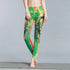 Woman wearing green and yellow lion print leggings, high-waisted, skinny fit