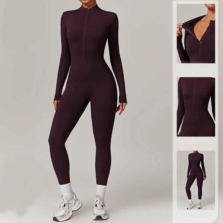 Woman wearing a fitted dark purple long sleeve zip-up jumpsuit with stretch fabric