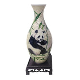 Ceramic vase-shaped puzzle featuring a panda and bamboo, displayed on a decorative wooden stand.