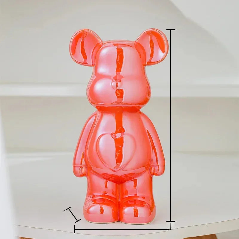 Glossy red bear-shaped figurine with heart detail on belly, ceramic, modern decor