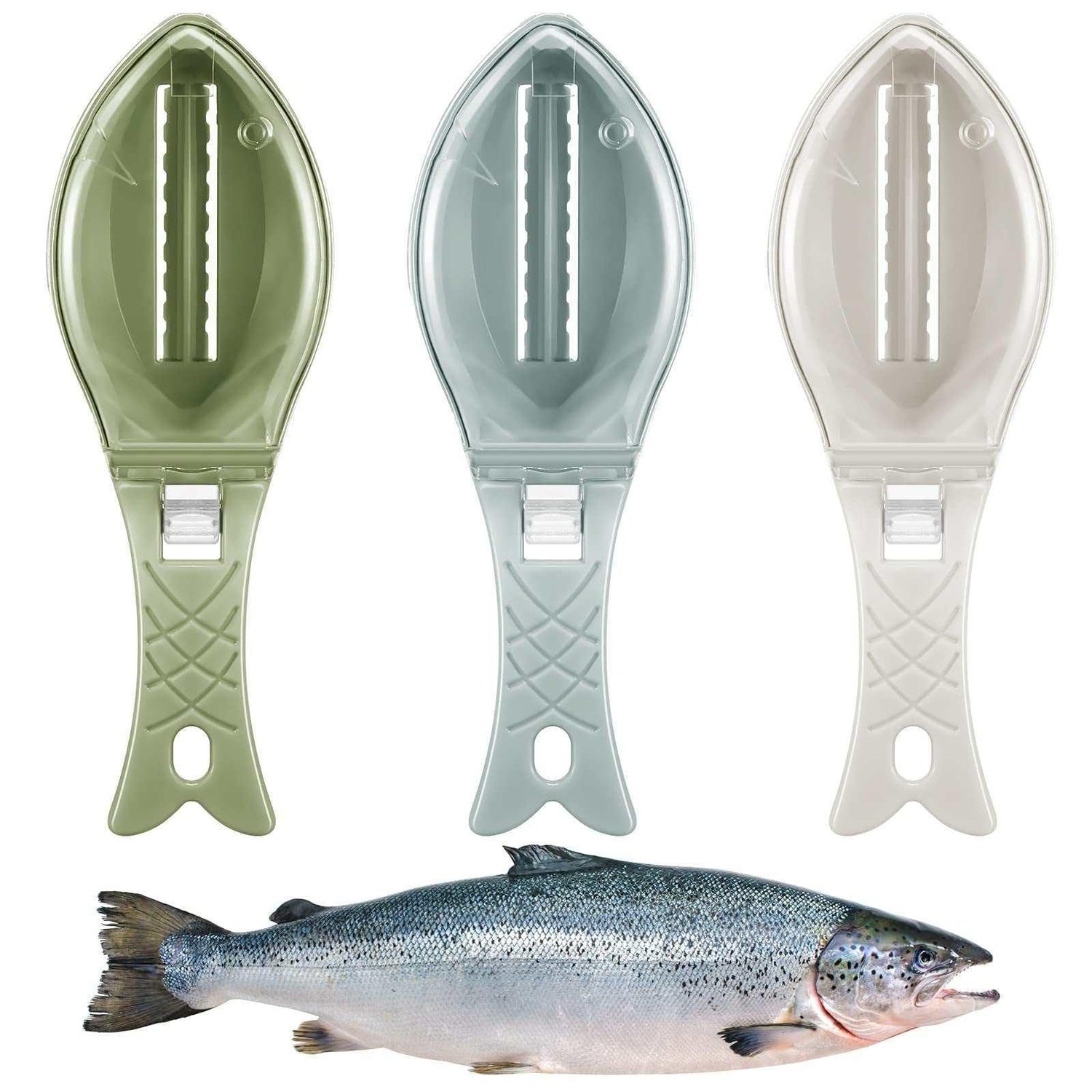 Three plastic fish-shaped fish scalers in green, blue, and white above a fresh fish.