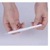 Hands holding a slim white pen with clear plastic cap, minimalist modern stationery