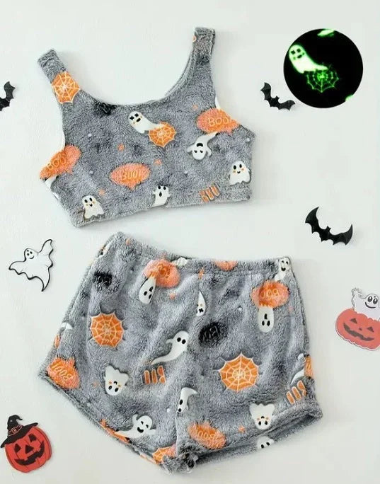 Gray fuzzy Halloween pajama set with ghost and pumpkin print, crop top and shorts, glow-in-the-dark accents