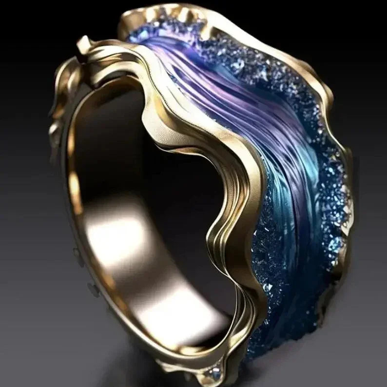 Wave-inspired gold ring with textured blue and purple resin, bold futuristic jewelry design