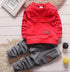 Red long-sleeve sweatshirt and gray jogger pants set, cotton, relaxed fit, modern streetwear style.