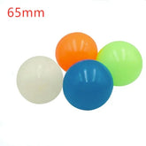 Set of four 65mm plastic balls in blue, white, orange, and green, glossy finish