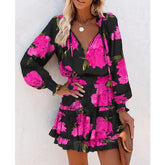 Woman wearing black long sleeve floral mini dress with pink flowers, ruffled skirt, relaxed fit