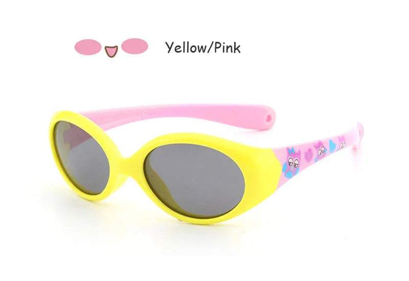 Oval yellow and pink sunglasses with black lenses and printed cartoon details on temples