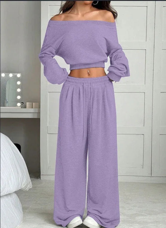 Woman wearing a lilac off-shoulder knit crop top and wide-leg lounge pants set