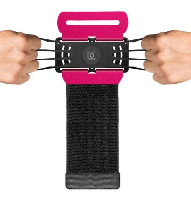 Adjustable black and pink elastic phone holder with Velcro strap, stretched by two hands