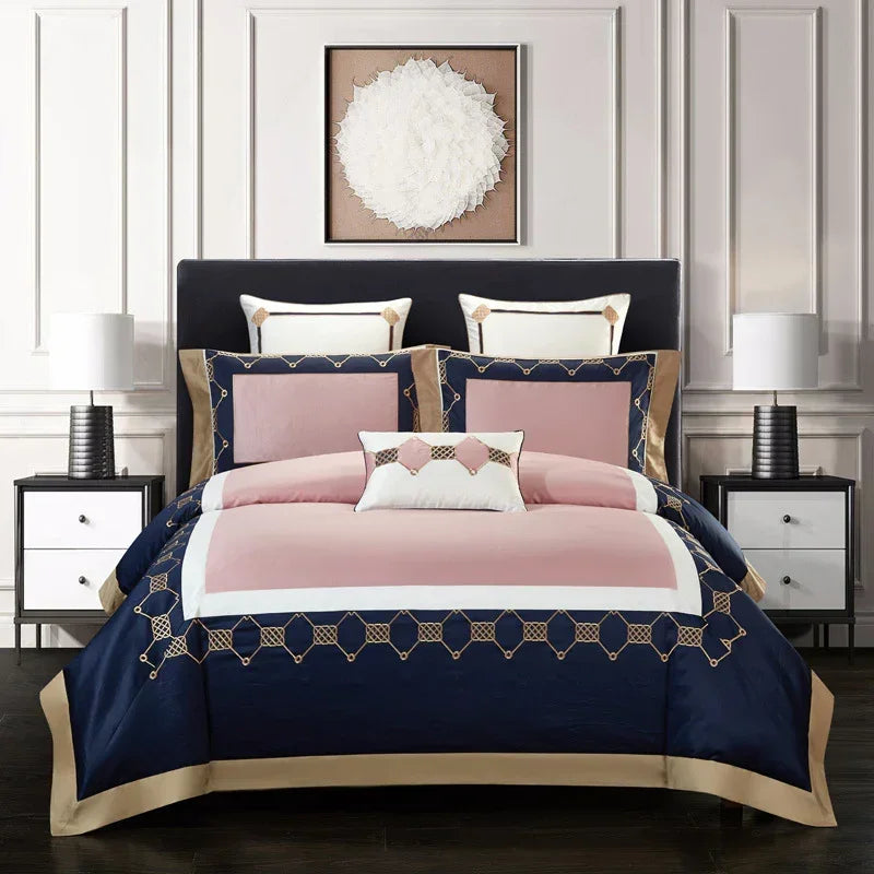 Modern blue, pink, and gold geometric bedding set with sleek, tailored fit in a chic bedroom