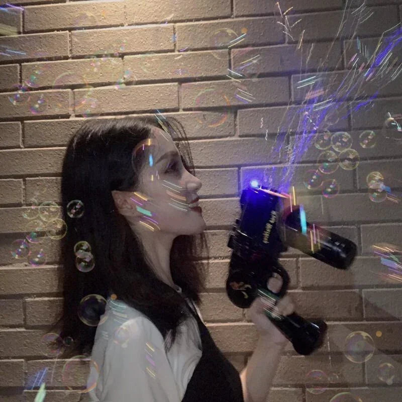 Woman in a casual black and white top, shooting bubbles with a bubble gun against a brick wall.