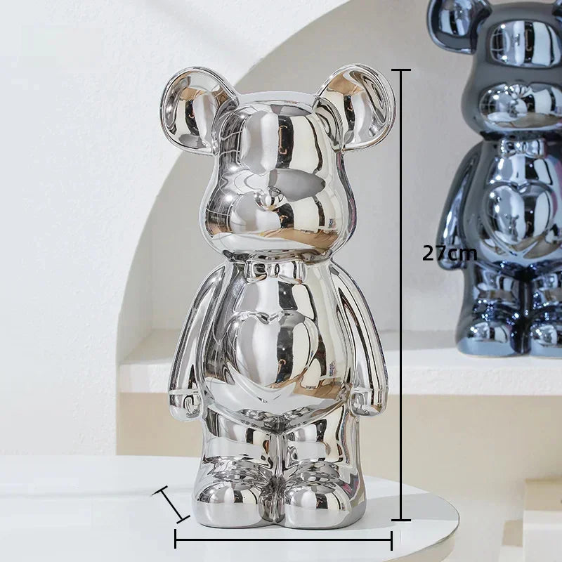 Shiny silver bear figurine with a reflective chrome finish standing upright, 27cm tall.
