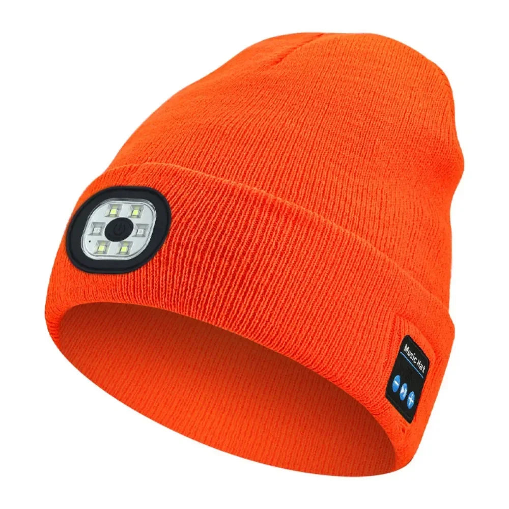 Bright orange knit beanie with built-in LED headlamp, tech accessory, unisex fit