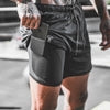 Black athletic shorts with side pocket, drawstring waist, and inner compression layer for gym or streetwear