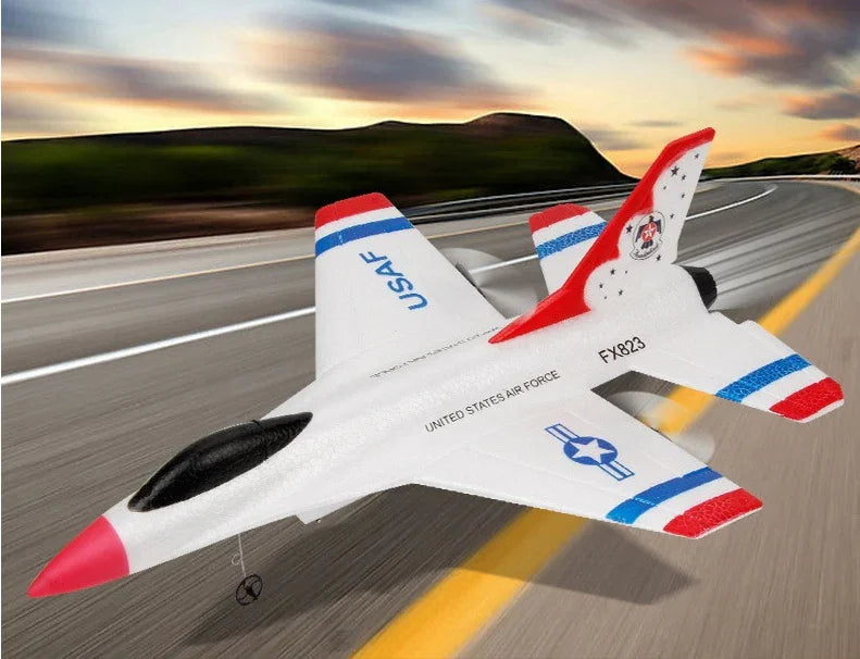 White toy jet airplane with red, blue, and black accents on a road background