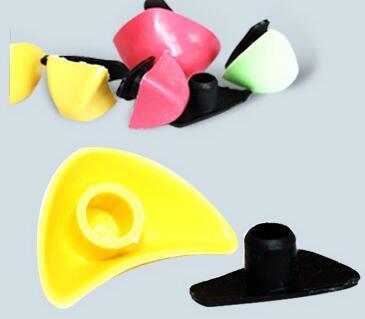 Colorful plastic accessories with curved design and smooth finish, assorted shapes and colors.