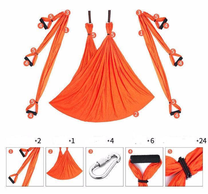 Bright orange aerial yoga swing set with adjustable straps, handles, and metal carabiner.