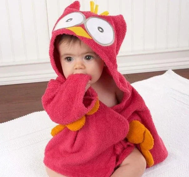 Baby wearing a red hooded owl towel robe with yellow accents and loose comfortable fit