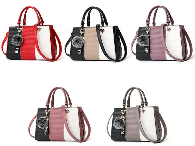 Five color block faux leather handbags with top handles, shoulder straps, and pom-pom charms.
