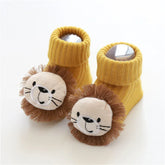 Yellow ribbed knit baby socks with plush lion face and brown mane, soft cozy fit